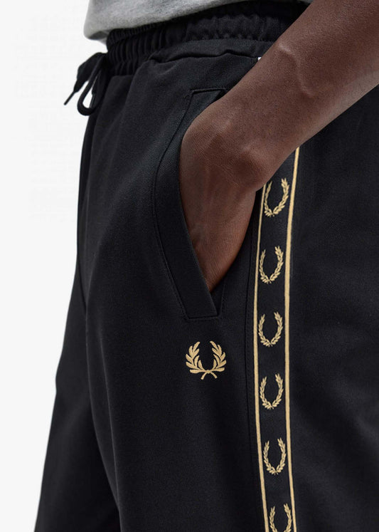 fred perry broek gold logo taped